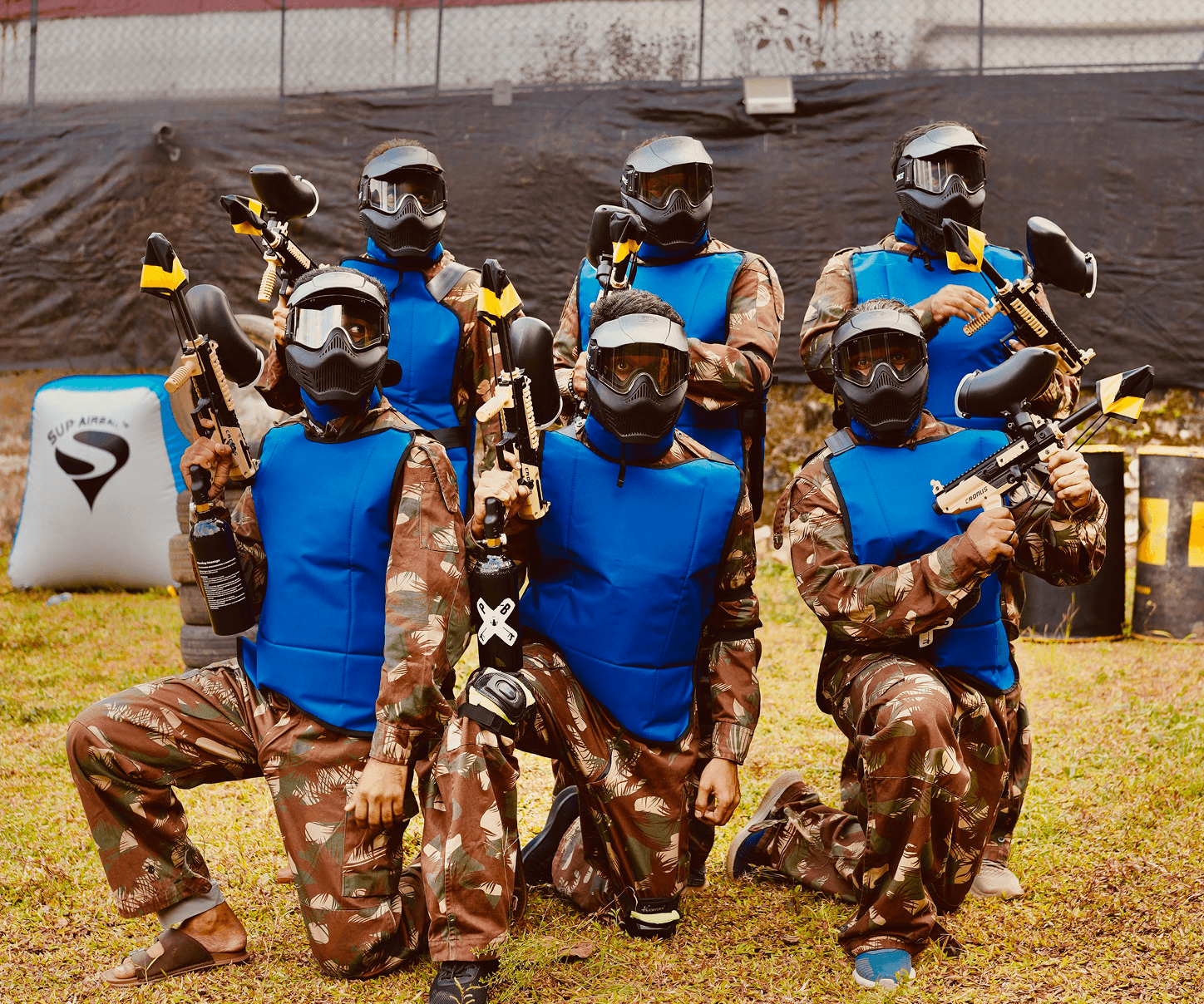 Team celebrating after a paintball match